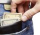 Pickpocket stealing a mans wallet