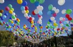 epa05586454 Georgian people walk under balloons as they attend the 'Tbilisoba' celebrations in Tbilisi, Georgia, 15 October 2016. The annual festival is dedicated to the Georgian capital of Tbilisi.  EPA/ZURAB KURTSIKIDZE